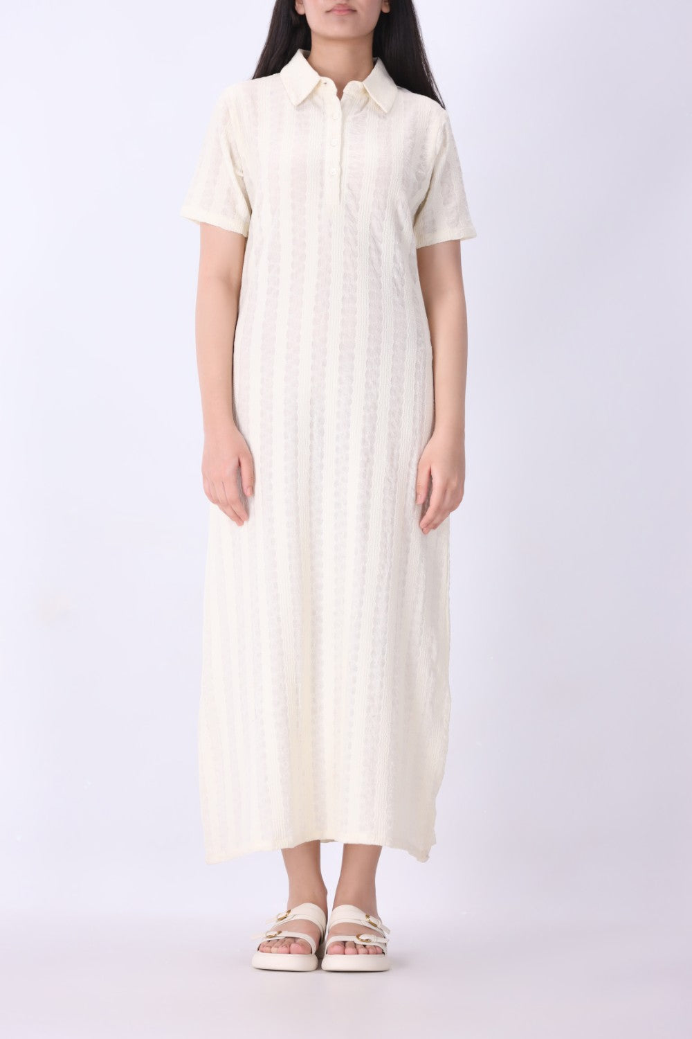 Cream pointelle dress with gold jewellery styling