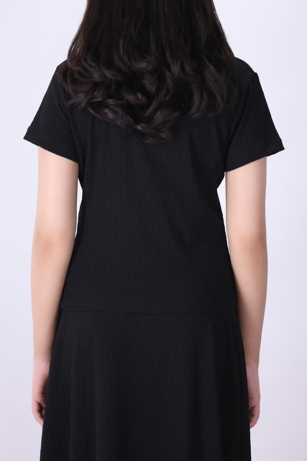 Back view of black textured t-shirt
