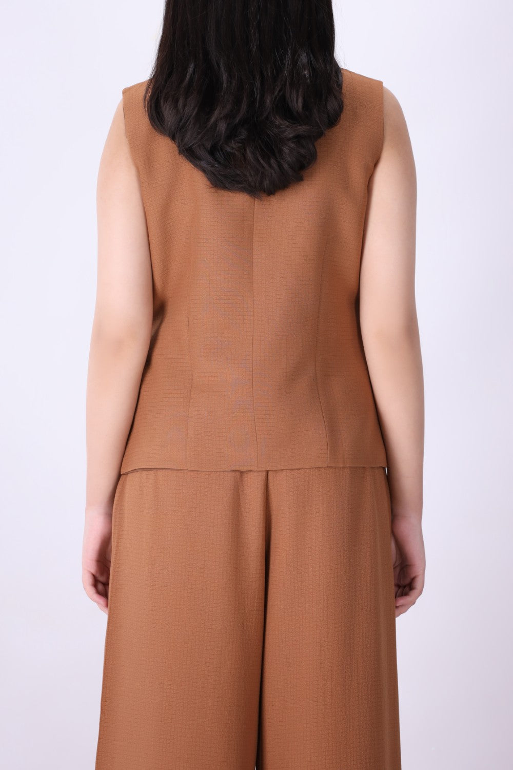 Back view of caramel tailored wrap vest
