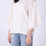 Back view of cream batwing top
