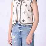 Back view of embroidered ivory vest
