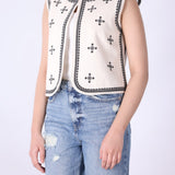 Back view of embroidered ivory vest

