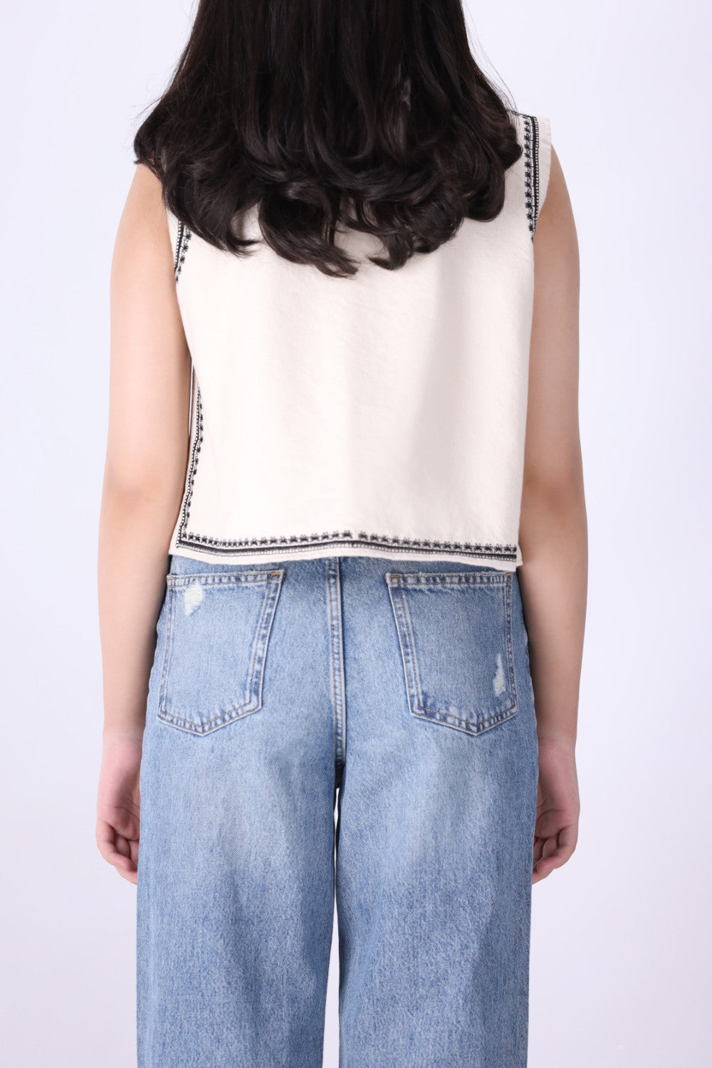 Back view of embroidered ivory vest FUMO