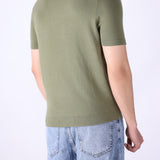 Back view of knitted t-shirt in sage green
