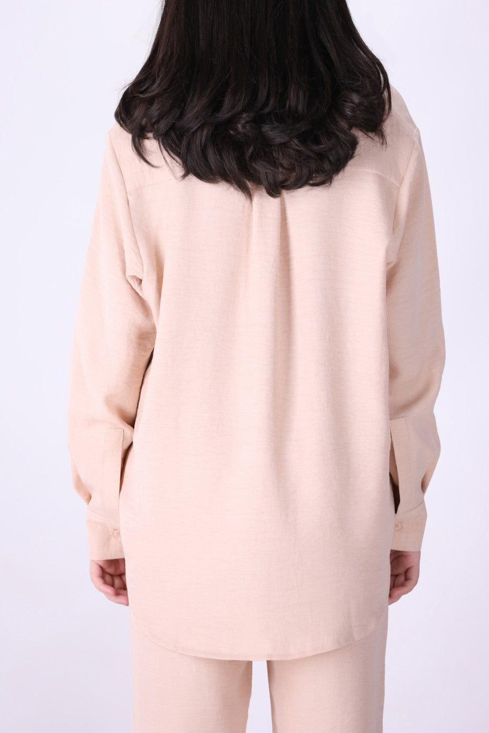 Back view of long sleeve blush shirt
