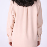 Back view of long sleeve blush shirt
