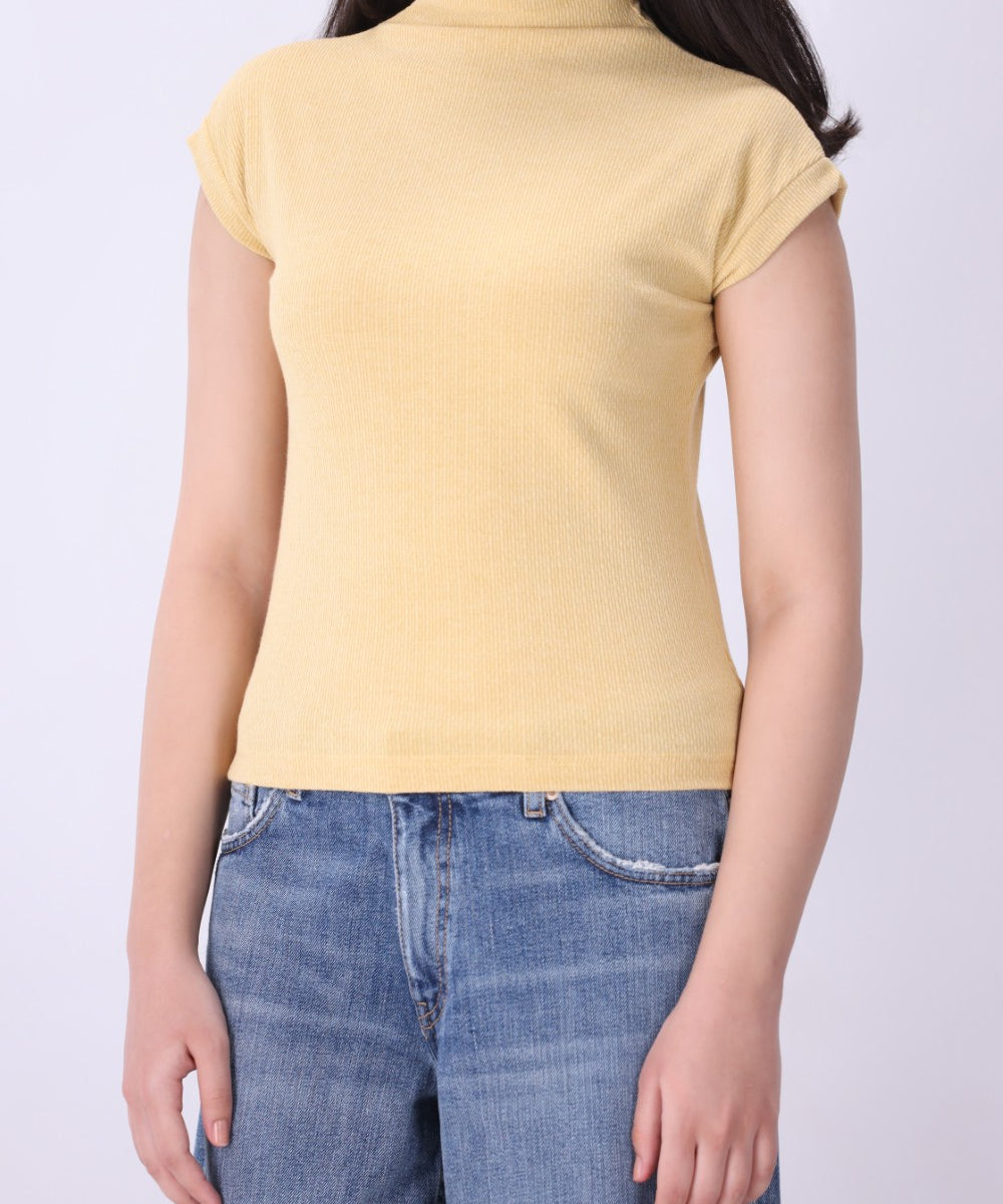 Back view of ribbed cap sleeve knit vest in latte
