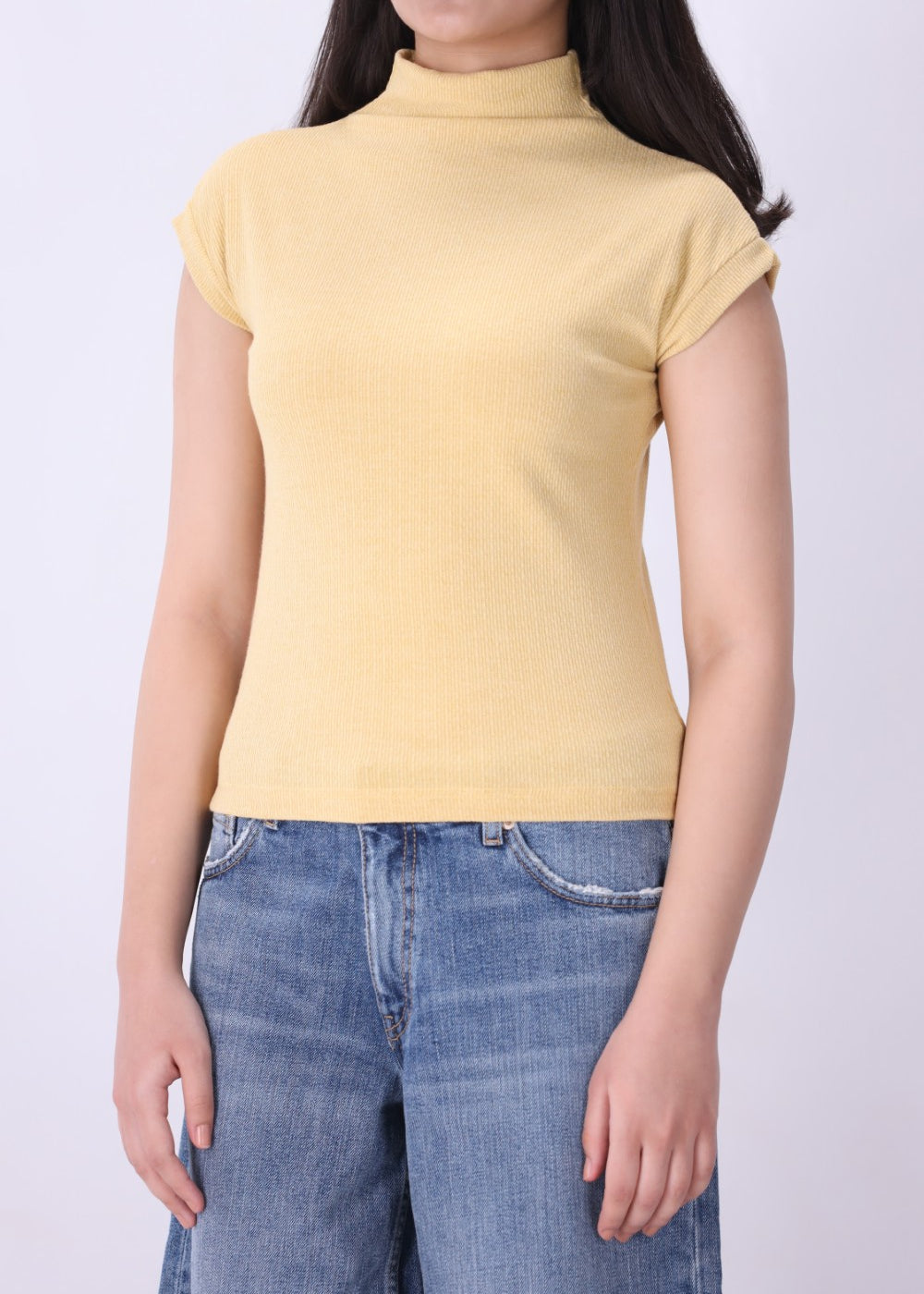 Back view of ribbed cap sleeve knit vest in latte
