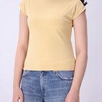 Back view of ribbed cap sleeve knit vest in latte
