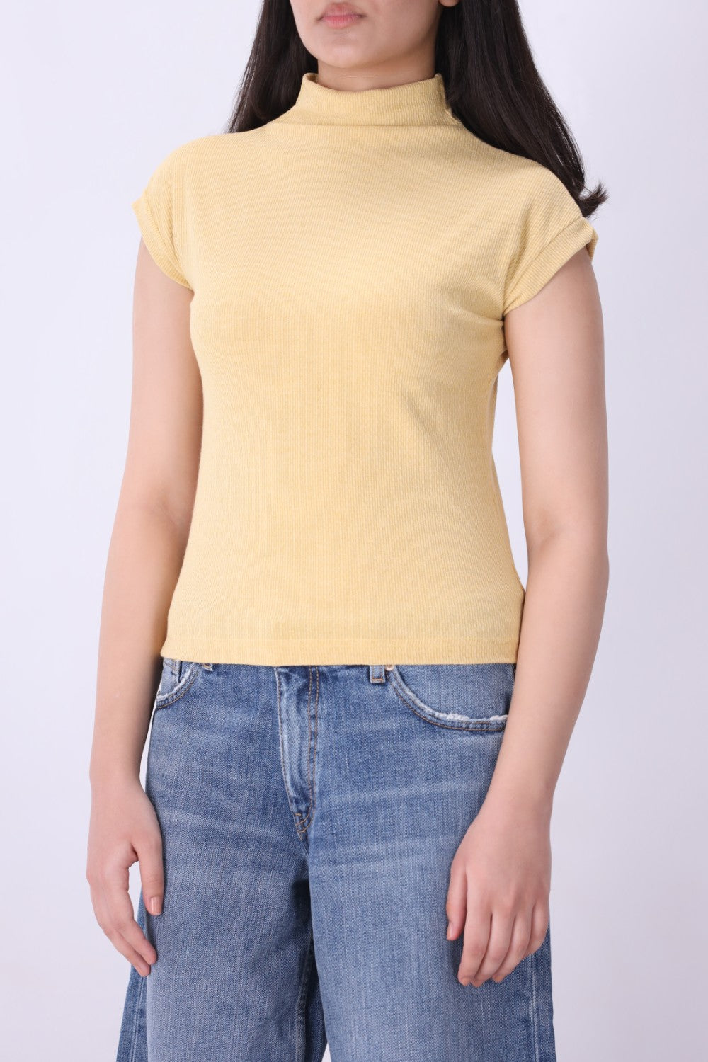 Back view of ribbed cap sleeve knit vest in latte
