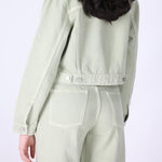 Back view of speckled green denim jacket
