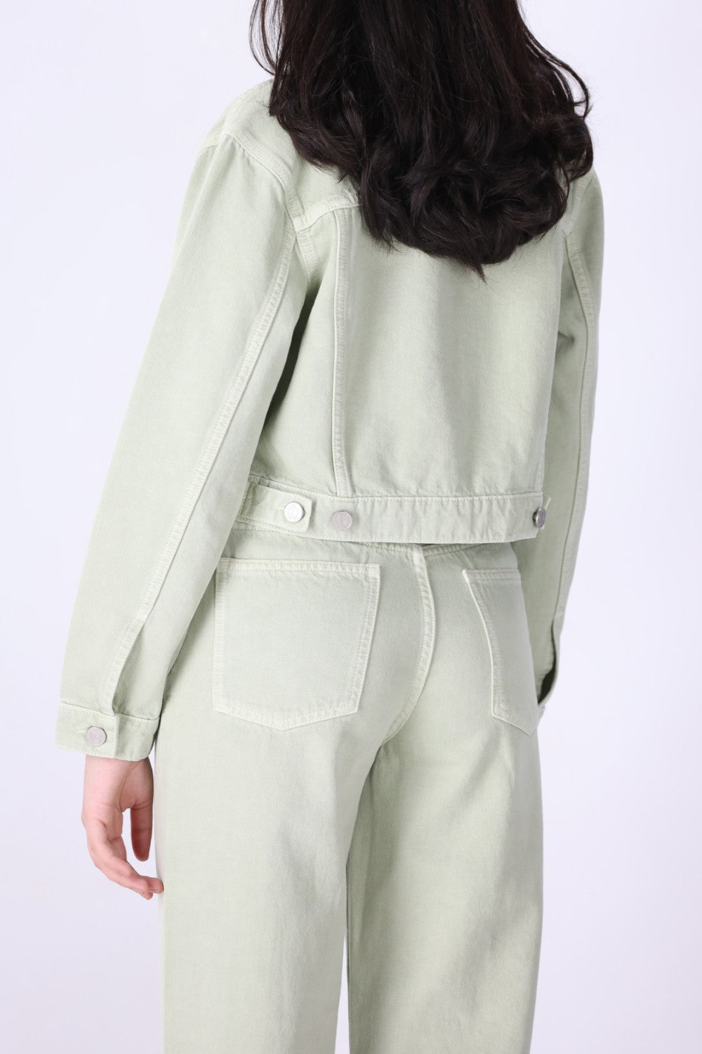 Back view of speckled green denim jacket
