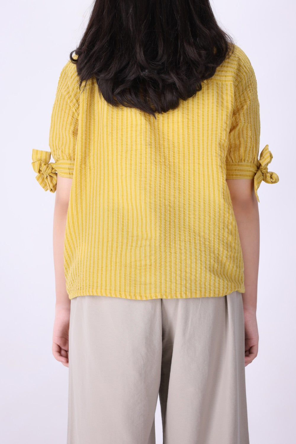 Back view of yellow striped shirt

