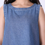 Chambray shell top layered under a blazer

