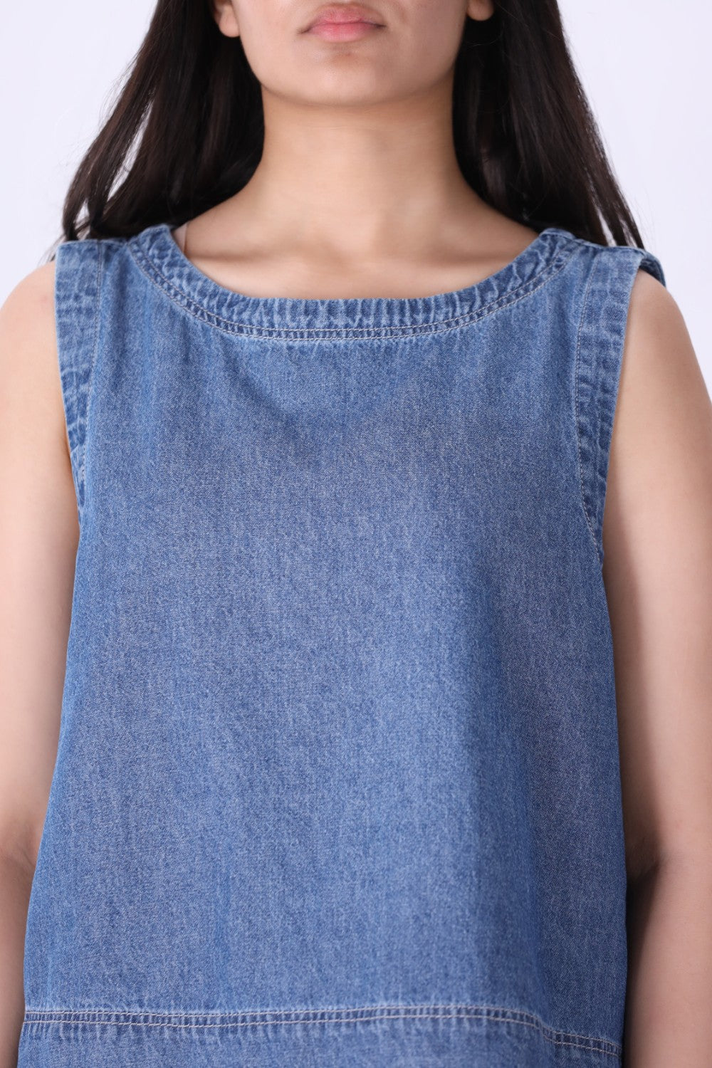 Chambray shell top layered under a blazer
