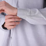 Close-up of cotton blend fabric and collar detail
