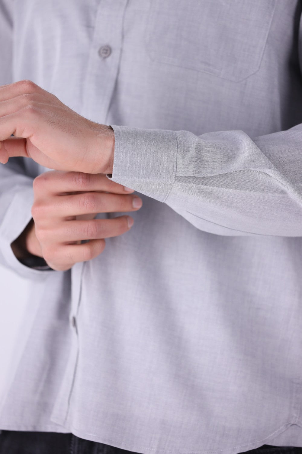 Close-up of cotton blend fabric and collar detail
