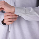 Close-up of cotton blend fabric and collar detail
