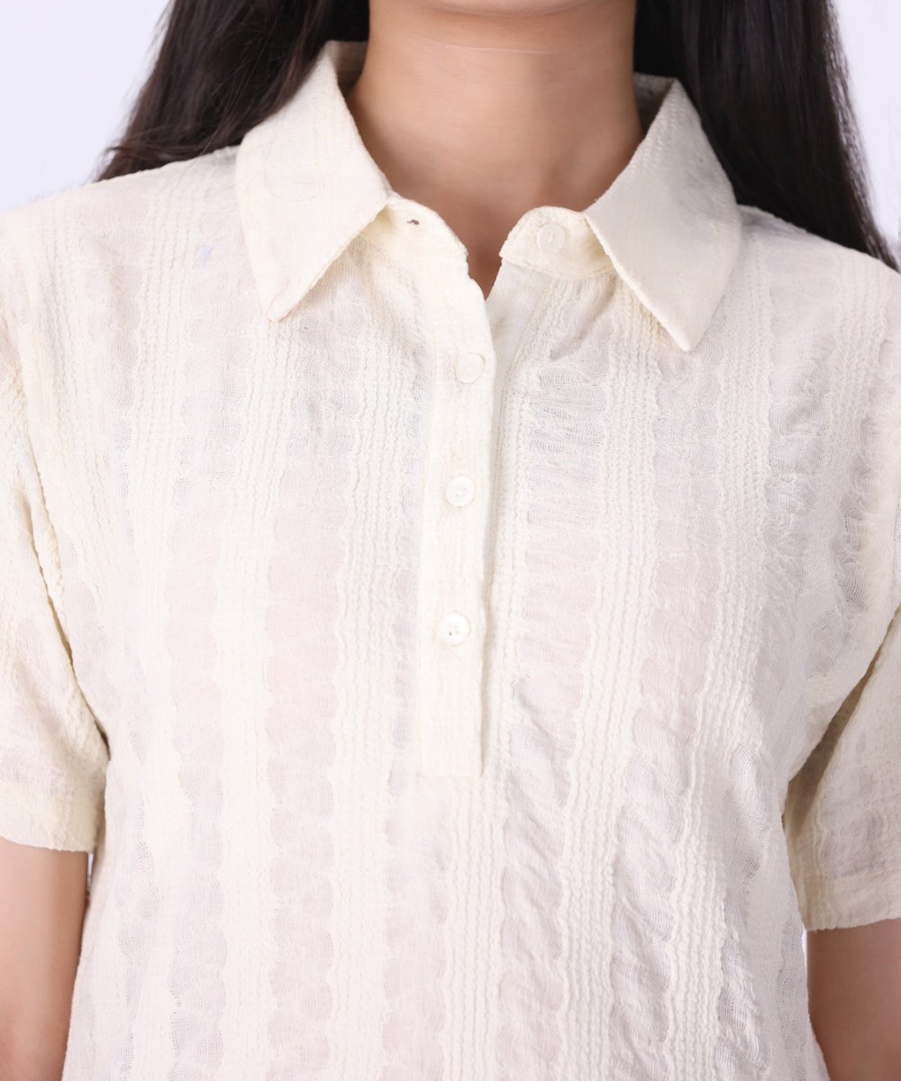 Close-up of open pointelle knit texture

