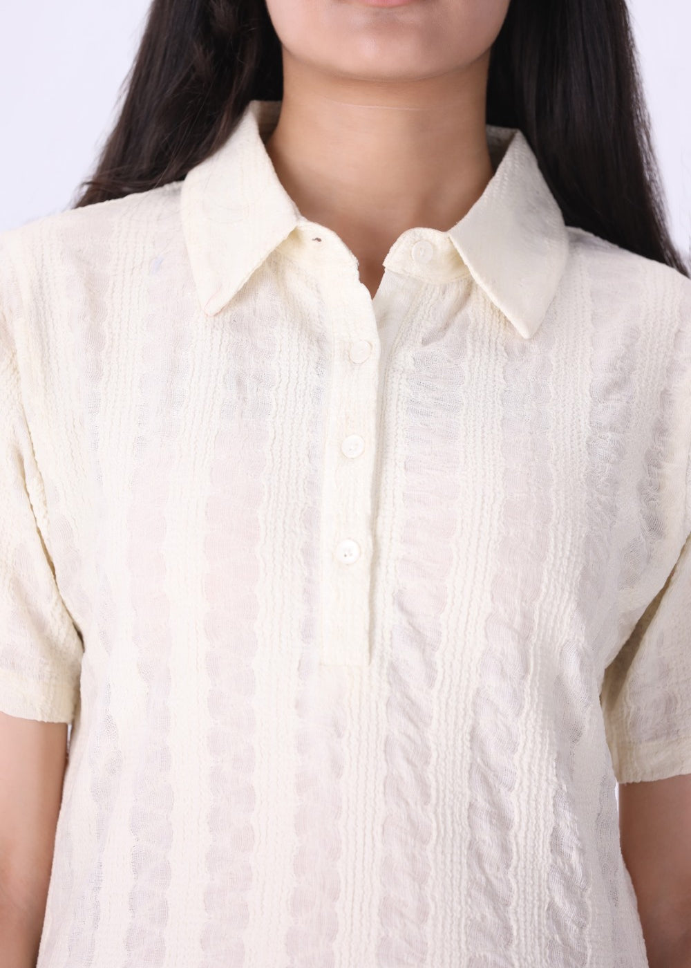Close-up of open pointelle knit texture
