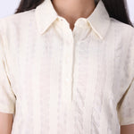 Close-up of open pointelle knit texture
