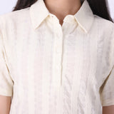 Close-up of open pointelle knit texture

