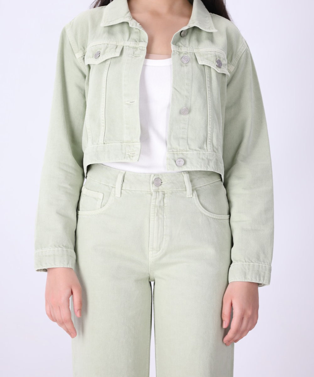 Close-up of speckled dye effect on green denim

