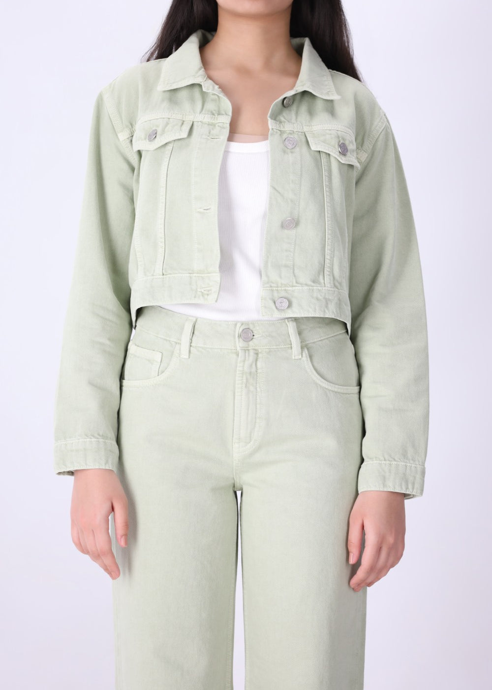 Close-up of speckled dye effect on green denim
