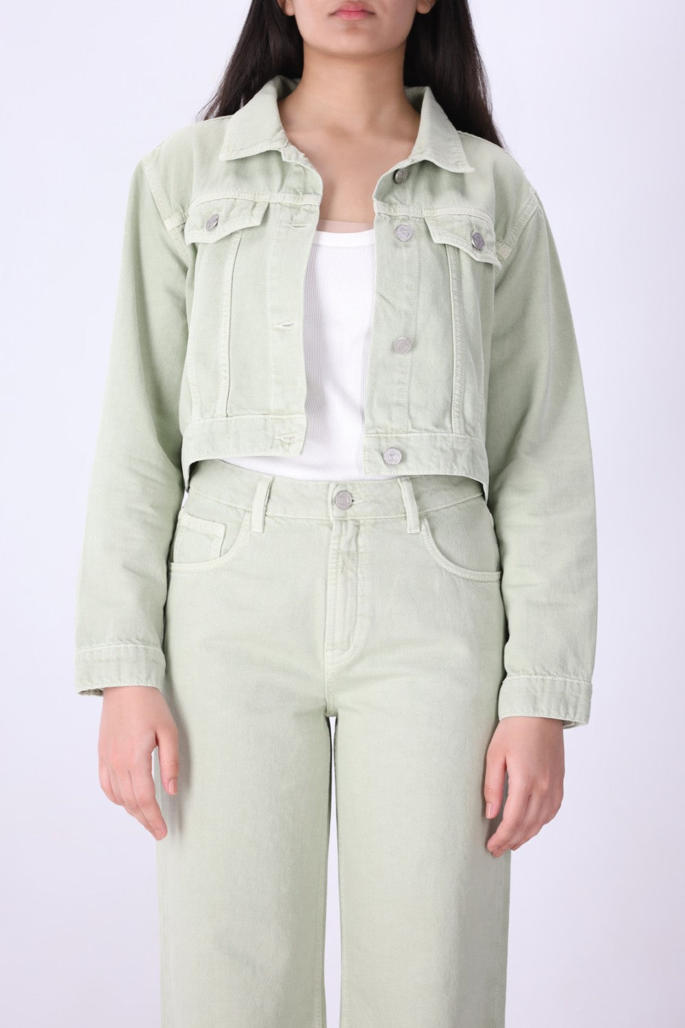Close-up of speckled dye effect on green denim
