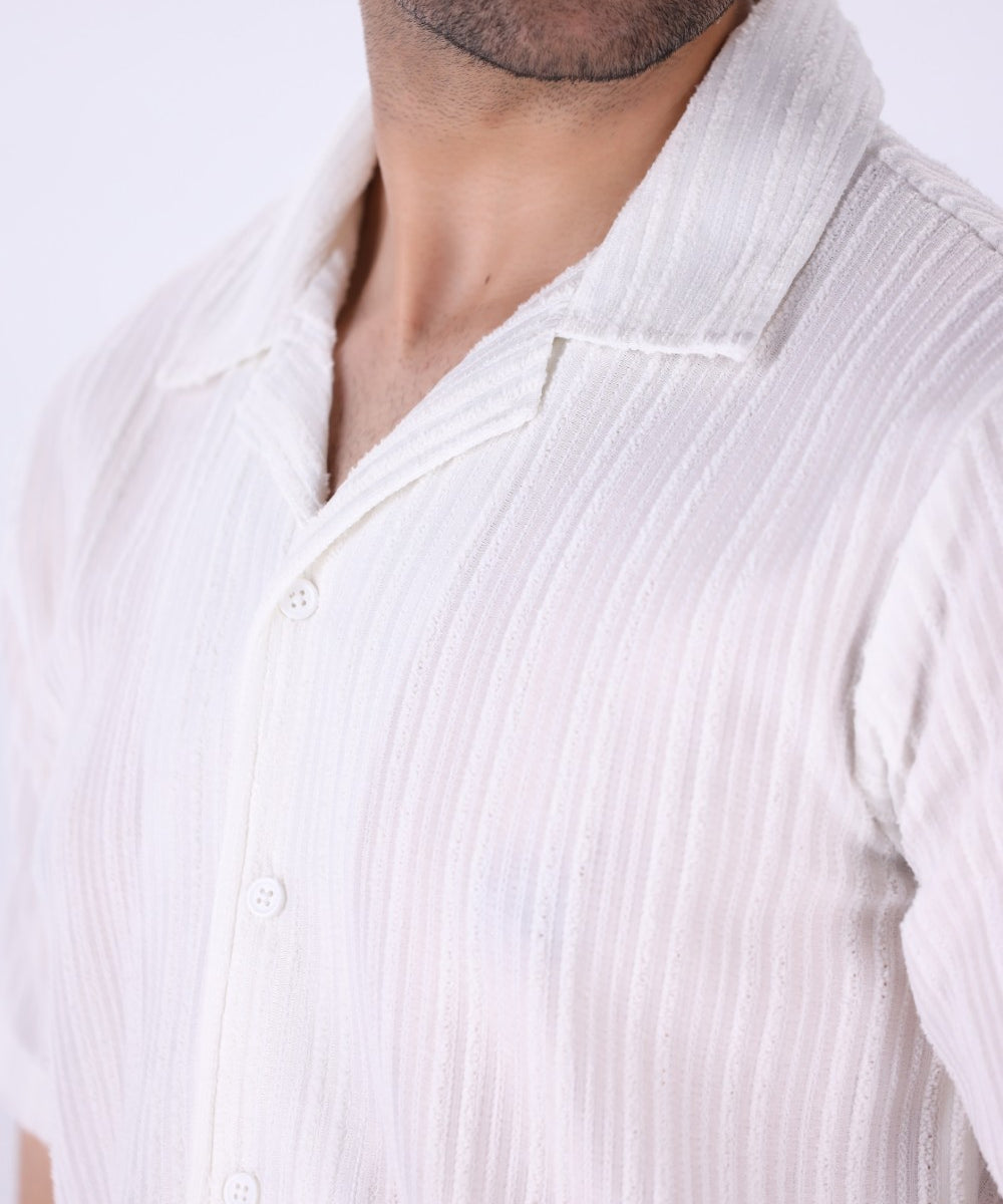 Close-up of vertical grain texture on white fabric
