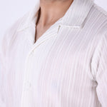Close-up of vertical grain texture on white fabric
