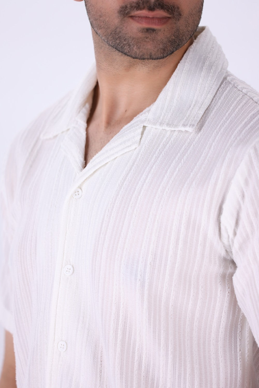 Close-up of vertical grain texture on white fabric
