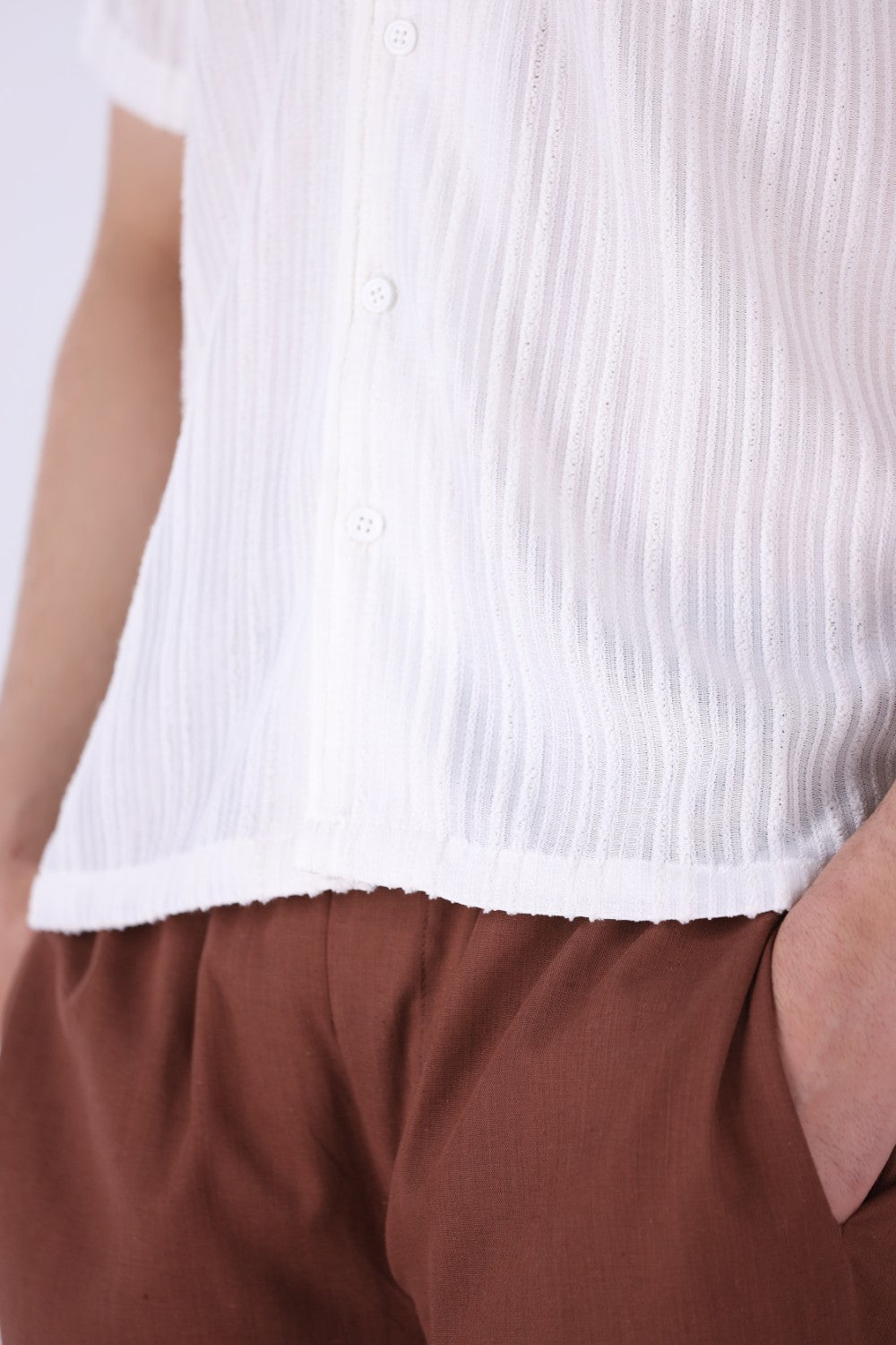 Close-up of vertical grain texture on white fabric
