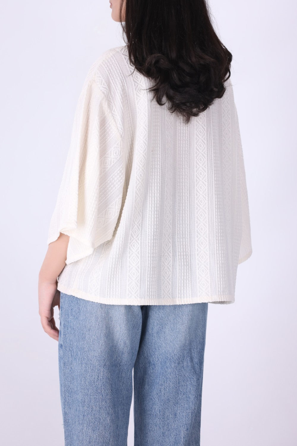 Cream oversized batwing textured top, front view
