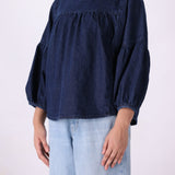 Denim top tucked into tailored trousers