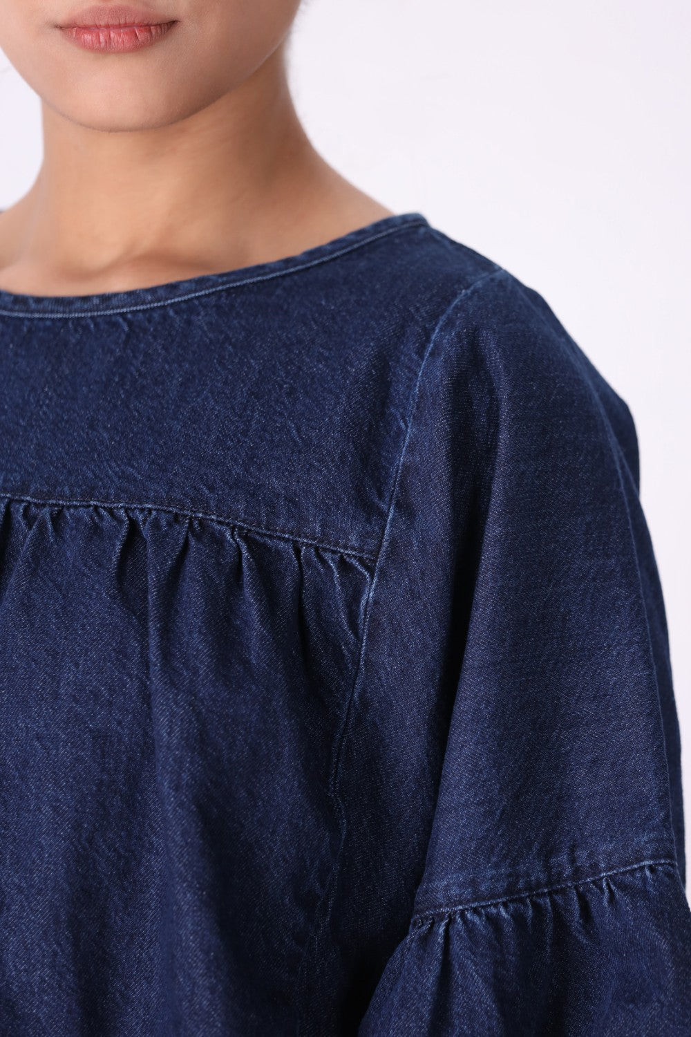 Denim top worn loose over jeans