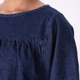 Denim top worn loose over jeans