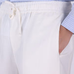 Drawstring trousers styled with a camp collar shirt
