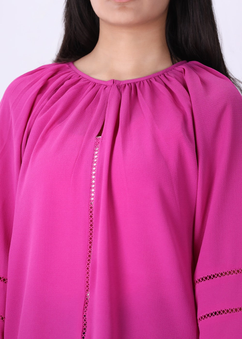 Hot pink blouse styled with white trousers