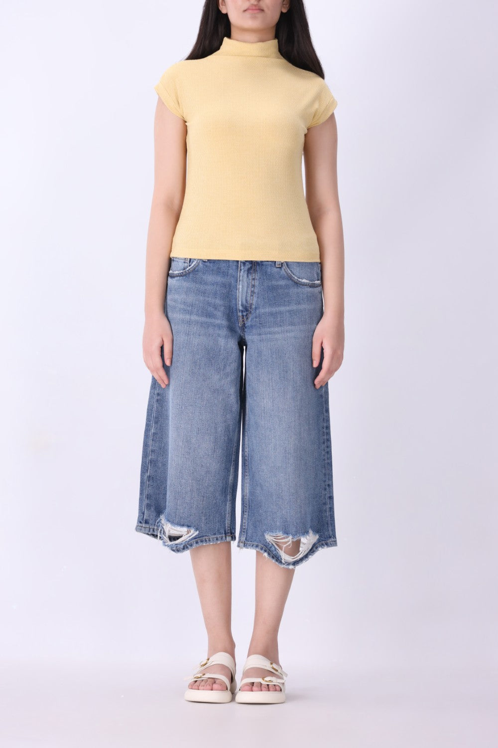 Latte knit vest with cap sleeves, side view
