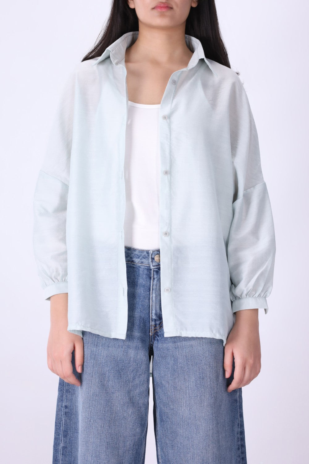 Light blue button-down shirt worn open over a tank
