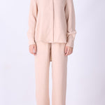 Pink long sleeve shirt styled with tailored trousers
