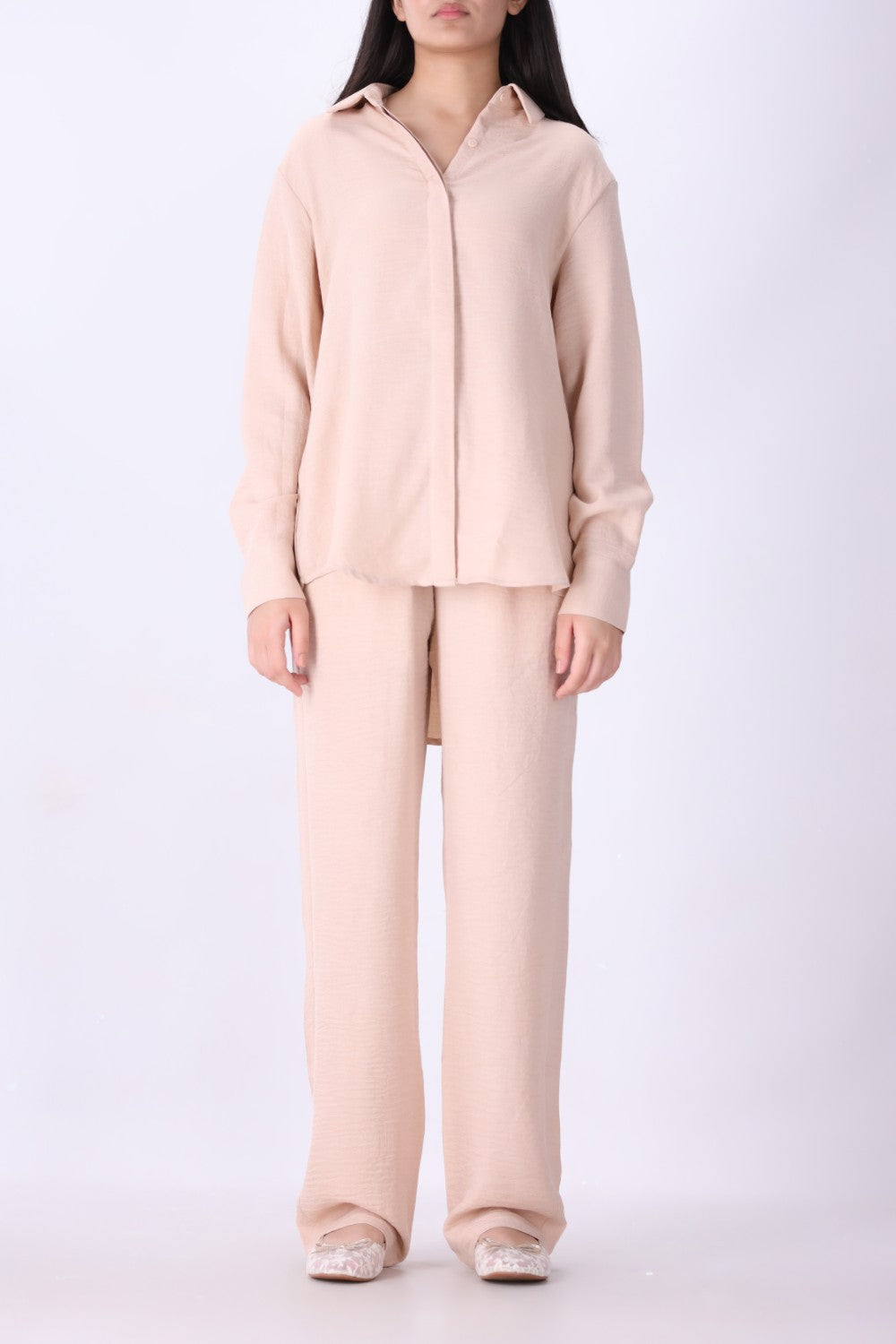 Pink long sleeve shirt styled with tailored trousers
