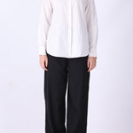 Pinstripe shirt in white styled with trousers