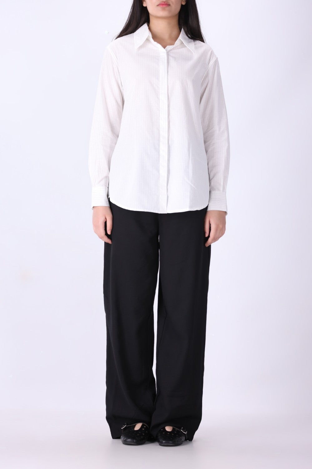 Pinstripe shirt in white styled with trousers