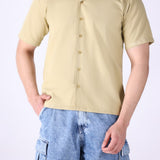 Relaxed camp collar shirt worn open over a tee
