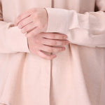 Side view of blush pink shirt
