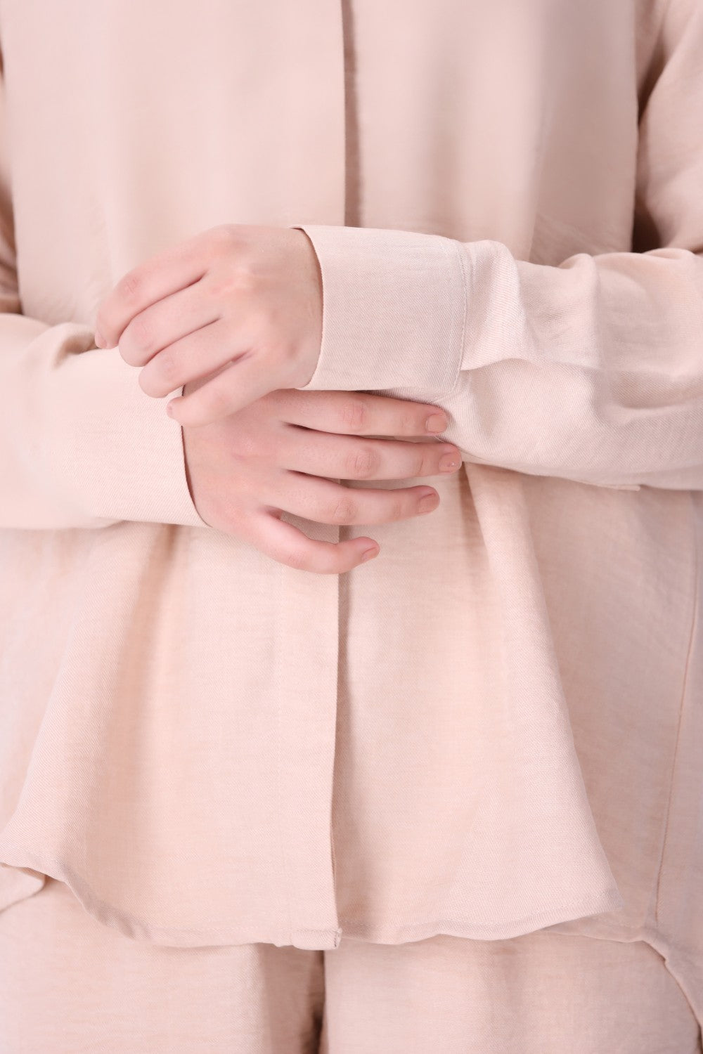 Side view of blush pink shirt
