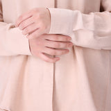 Side view of blush pink shirt
