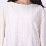 Side view of oversized batwing sleeve drape
